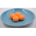 Bonbon gommeux en forme de balle de golf au goût d'orange 